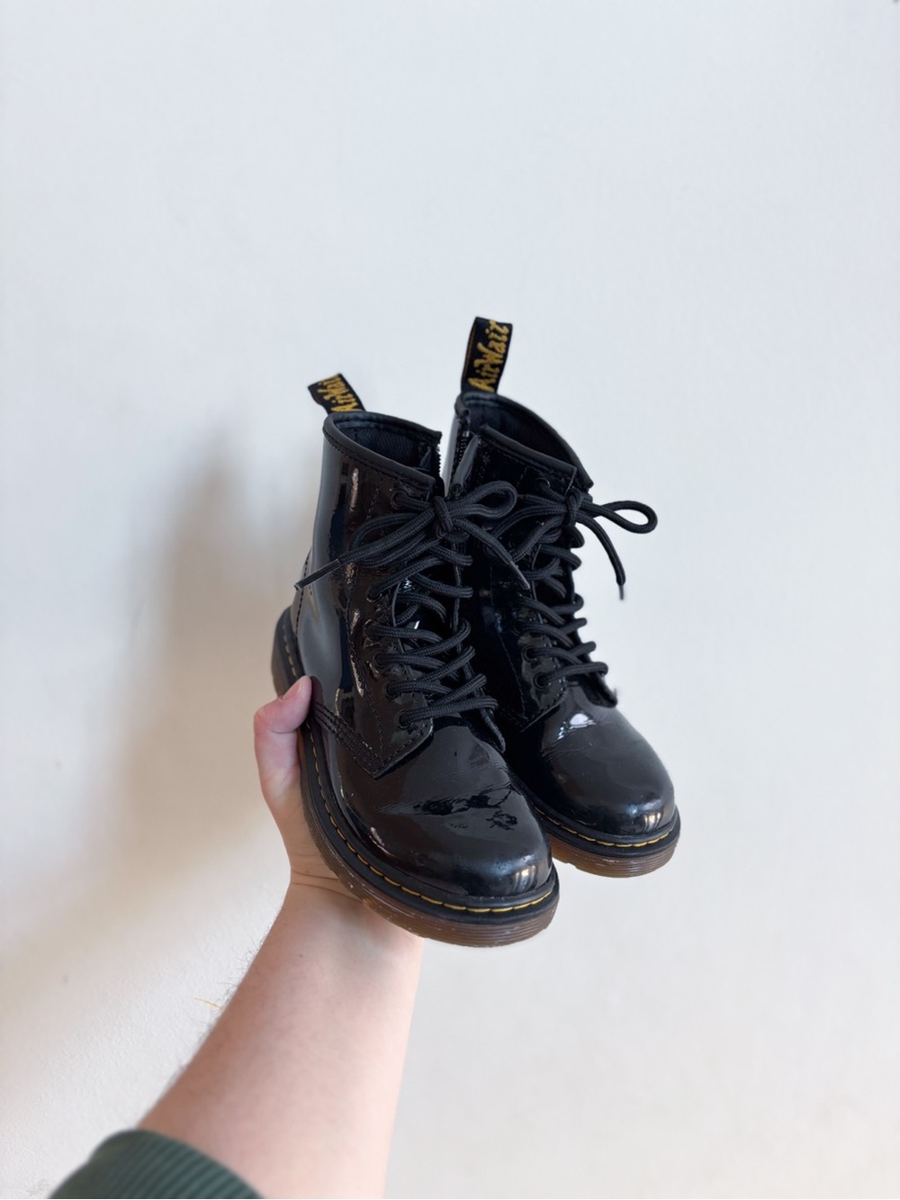Dr. Martens Black Patent Lace-Up Combat Boots with Yellow Heel Loop